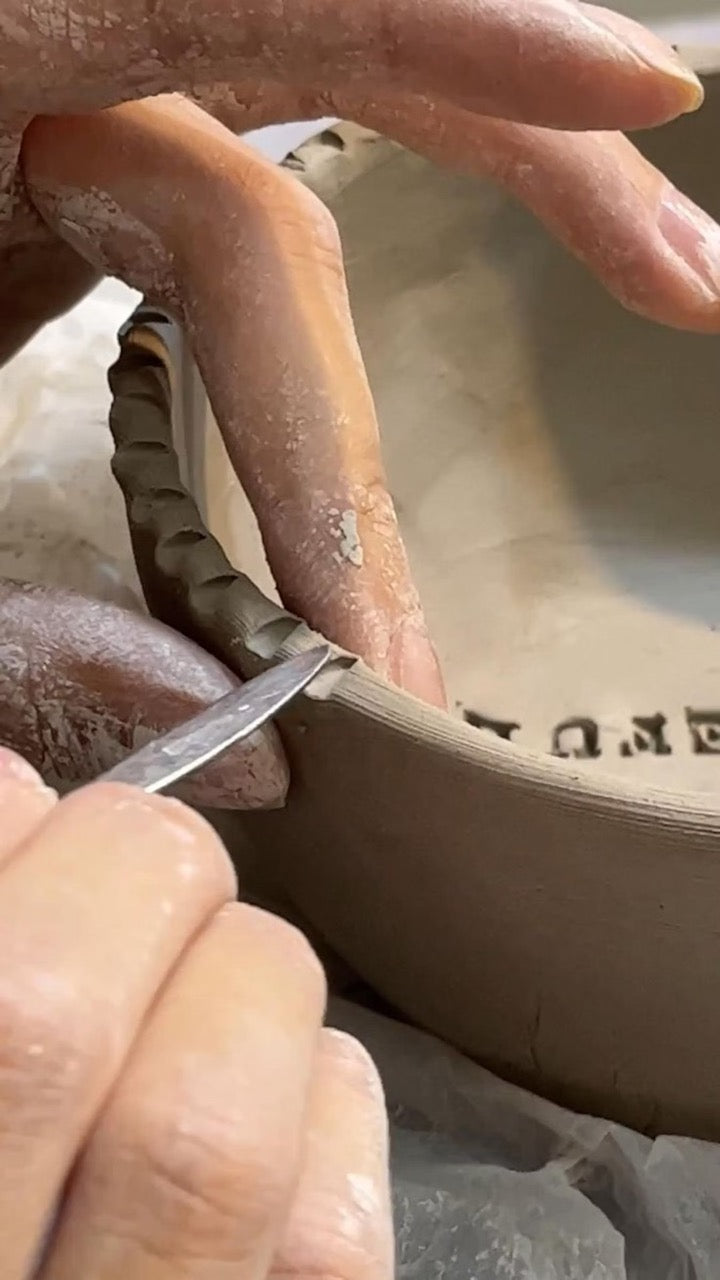 Create a small ceramic object and paint it