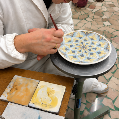 Mold a ceramic vase and decorate it with flowers in Florence