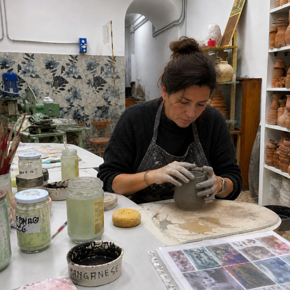 Mold a ceramic vase and decorate it with flowers in Florence