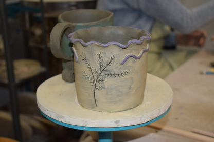 Create a small ceramic object and paint it